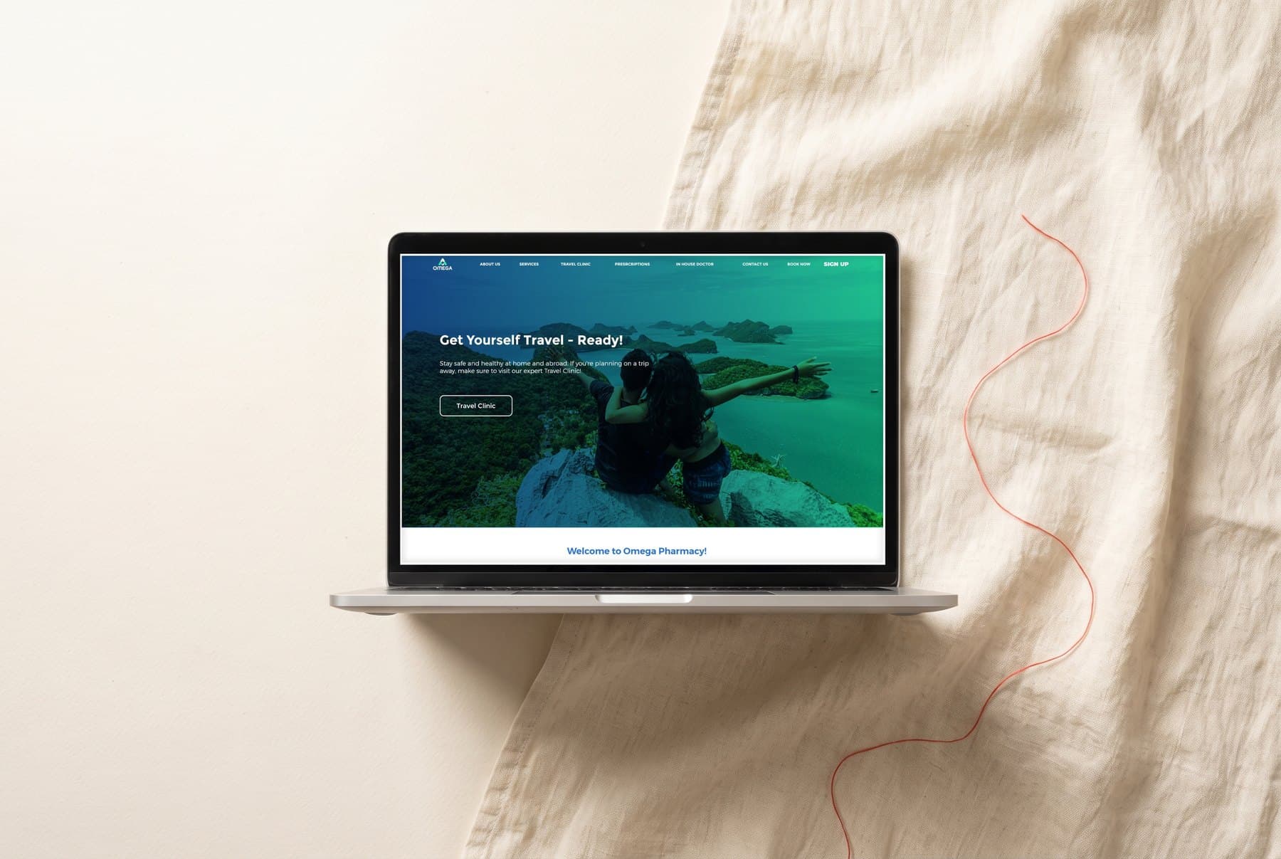 Omega Pharmacy website on a laptop